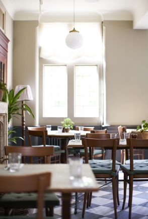 tables-laid-for-service-in-empty-restaurant-2024-10-19-07-03-12-utc